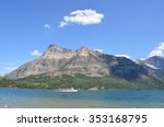 The historic M.V. International cruises past Vimy peak on Waterton Lake, Alberta, on her way to Goats Haunt, Montana.