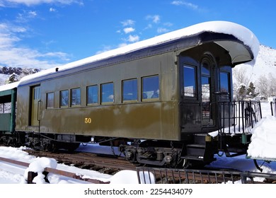 Historic Narrow Gauge Combine Passenger Car 50 Sitting in the Snow - Shutterstock ID 2254434079