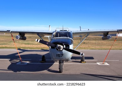 Historic O-2 Aircraft With Rocket Pods Sitting On Airport Tarmac, Front View