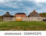 Historic Old Fort Western in Augusta, ME, on a cloudy day in Fall season