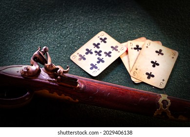 Historic Playing Cards With A Rifle On The Table