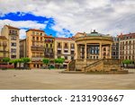 Historic Plaza del Castillo with restaurants and a central domed gazebo in Old Town, famous for running of the bulls in Pamplona, Spain