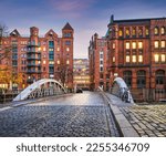 Historic Red Brick Buildings and cobblestone Holländischer Brook Fleet bridge in Hamburg, Germany
