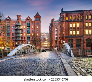 Historic Red Brick Buildings and cobblestone Holländischer Brook Fleet bridge in Hamburg, Germany - Powered by Shutterstock