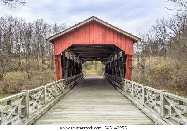 The historic Shaeffer\
Campbell Covered Bridge cross College Pond on a campus in St.\
Clairsville, Ohio.