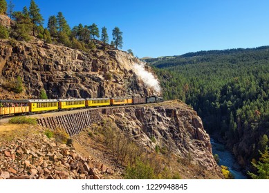 Historic steam engine train travels from Durango to Silverton through the San Juan Mountains in Colorado, USA.