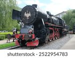 a historic steam locomotive on the university of science and technology grounds, Kraków