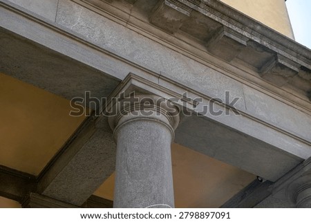 historic stone column and classical architecture detail, neoclassical building facade with granite pillar, heritage landmark structure, architectural design, restoration, construction texture