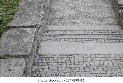 A historic stone staircase with cobblestone steps and rugged sidewalls, blending rustic charm with architectural detail. Ideal for outdoor, heritage, and design themes. - Powered by Shutterstock