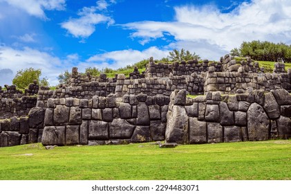 The historic stone walls of the Inca Sacsayhuaman citadel in Cusco town, Peru, a famous UNESCO World Culture Heritage site and a popular travel destination in Peru