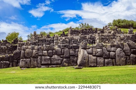The historic stone walls of the Inca Sacsayhuaman citadel in Cusco town, Peru, a famous UNESCO World Culture Heritage site and a popular travel destination in Peru
