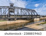 Historic swing span of the Arsenal or Government bridge swings open over the Lock and Dam No. 15 in Davenport, Iowa