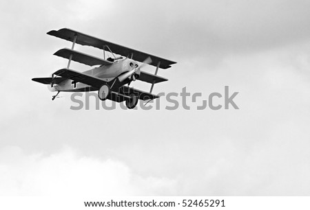 Historic triplane on the sky - vintage style photography