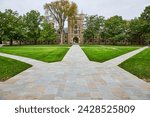 Historic University Building with Autumnal Trees and Pathways