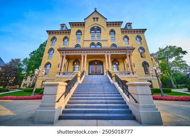 Historic University Building with Grand Staircase and Columns Low-Angle View - Powered by Shutterstock