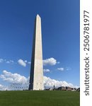 historic Washington monument in Washington DC with a blue sky and clouds