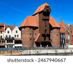 Historic waterfront on Motlawa, the old town of Gdansk, Poland. The famous crane, formerly a port crane, today a museum.