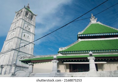 the historic weathered tower at the Kampung Kling mosque built in 1748 in the city of Malacca Malaysia on a blue sky day. - Shutterstock ID 2168875253