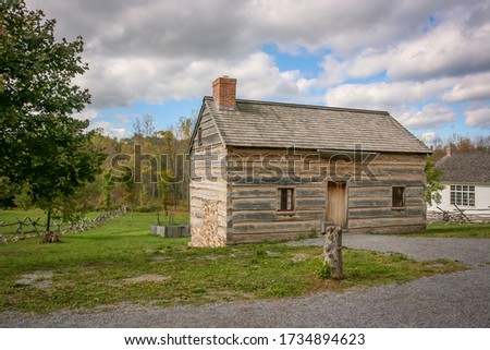 Historic wood log cabin in the woods
