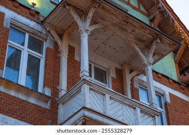 Historic Wooden Balcony on a Brick Building Highlighting Architectural Details in a Charming Neighborhood During Daylight. - Powered by Shutterstock