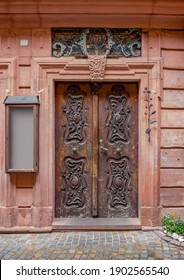 historic wooden ornamented door seen in Wertheim am Main in Southern Germany