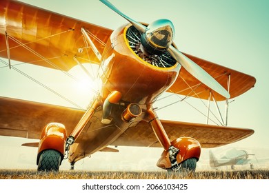 historical aircraft against a sunset