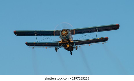 Historical biplane flying. Single engine aircraft designed in 1947. Old utility plane used in forestry and agriculture for crop-spraying. - Shutterstock ID 2197285255