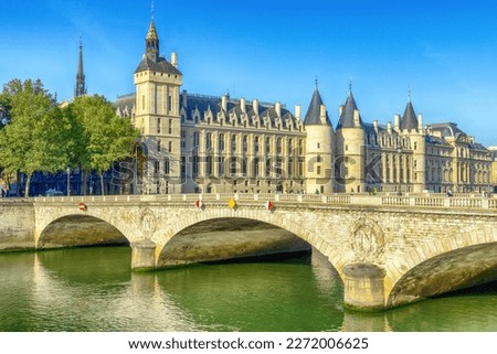 Historical building Consiergerie Castle(Palais de Justice), Pont Neuf and Seine river at summer, Paris, France