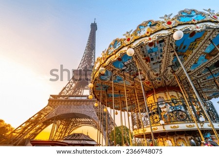 Historical Carousel of the Eiffel Tower. Morning photography at sunrise time. Paris, France