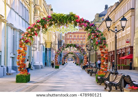 Historical center of Moscow - Nikolskaya street decorated with arches of flowers.