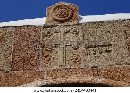 Historical decor adorns the outer wall of St. Mary's Church. The St. Mary's Church, Holy Virgin or Panagia of Lindos, in Lindos on Rhodes, was built in the 15th century. Rhodes Island, Dodecanese
