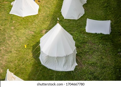 Historical Festival White Tent Middle Age Time Reconstruction Object Strategy Top View Concept Foreshortening Of Camp Site Without People Here On Bright Grass Meadow Under Sun Light  