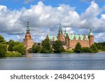 Historical Frederiksborg castle on a lake in Hillerod, Denmark. Frederiksborg is one of the largest royal castles in Scandinavia