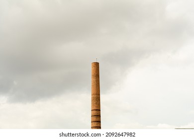 Historical industrial chimney in the center of Eskişehir, Turkey. Smokestack made of red brick. Pipe left over from brick factory. Tower, which is architecturally the symbol of the city.
