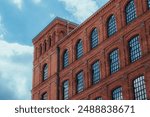 Historical industrial red brick factory building. Manufaktura - shopping and entertainment center. Lodz, Poland.