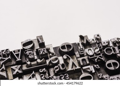 Historical letterpress types, also called as lead letters. These kind of letters were used in Gutenberg presses. These letters were the beginning of typography. And were used in typesetting - Shutterstock ID 454179622