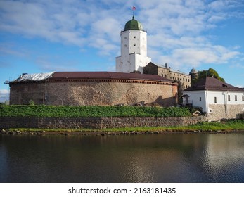 Historical monument. View of the Vyborg Castle, the embankment and the tower of St. Olaf. Russia, Leningrad region.