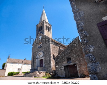 Historical old catholic church in France, Europe. Architectural masterpiece, historical church with towering structure and clear blue sky.