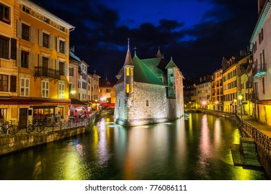 Historical Old Town of Annecy with Palais on a river island, France, illuminated at night