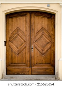 Historical Ornate Wooden Door in a Stone Entry with Arc, Prague, The Czech Republic
