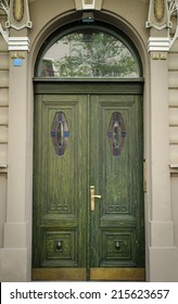 Historical Ornate Wooden Door in a Stone Entry with Arc and Pillars, Prague, The Czech Republic