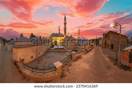 Historical Peykler Madrasa of Uc Serefeli Mosque in Edirne, Turkey at sunset. A madrasa is an Islamic institution where students study theology, jurisprudence, philosophy, and Islamic law and culture.