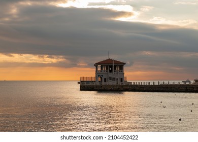 The historical pier in the Moda district of Kadikoy on Istanbul's Asian shore. Cloudy sky. Copy paste, text space. Horizontal banner. Empty space for text. - Shutterstock ID 2104452422