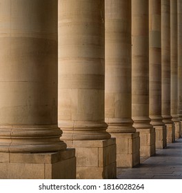 Historical Round Shaped Sandstone Pillar In A Row Close Up