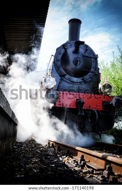 Historical steam engine\
train in motion