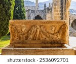 Historical stone carved sarcophagus in Bellapais Abbey, Northern Cyprus. The  monastery built by The Canons Regular of St. Augustine in the 13th century on the northern side of the small village.