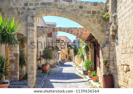 Historical streets of old town Rhodes with flowers in Rhodes, Dodecanese, Greece