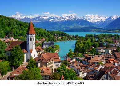 Historical Thun city and lake Thun with snow covered Bernese Highlands swiss Alps mountains in background, Canton Bern, Switzerland - Shutterstock ID 1438073690