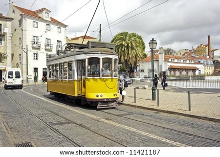 Historical tram driving through Lisbon city in Portugal Stock photo © 