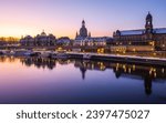 The historical waterfront of Elbe river with baroque buildings in Dresden early in the winter dawn. 